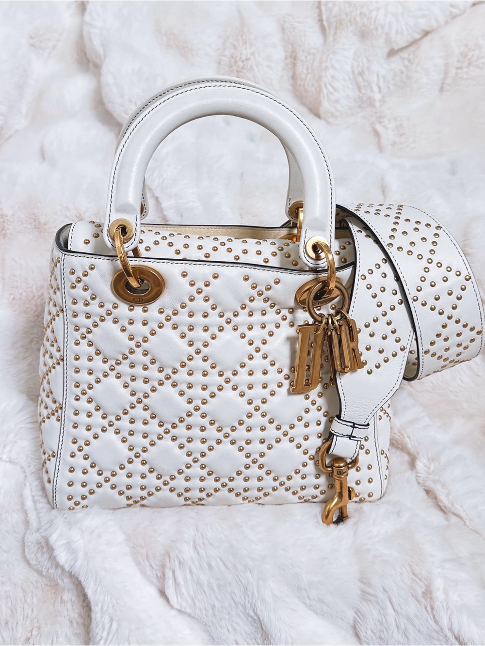 Dior Lady Dior bag in white quilted lambskin with gold stud embellishments